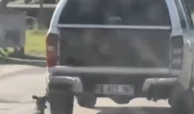 Aracın arkasına bağladığı köpeği metrelerce sürükledi